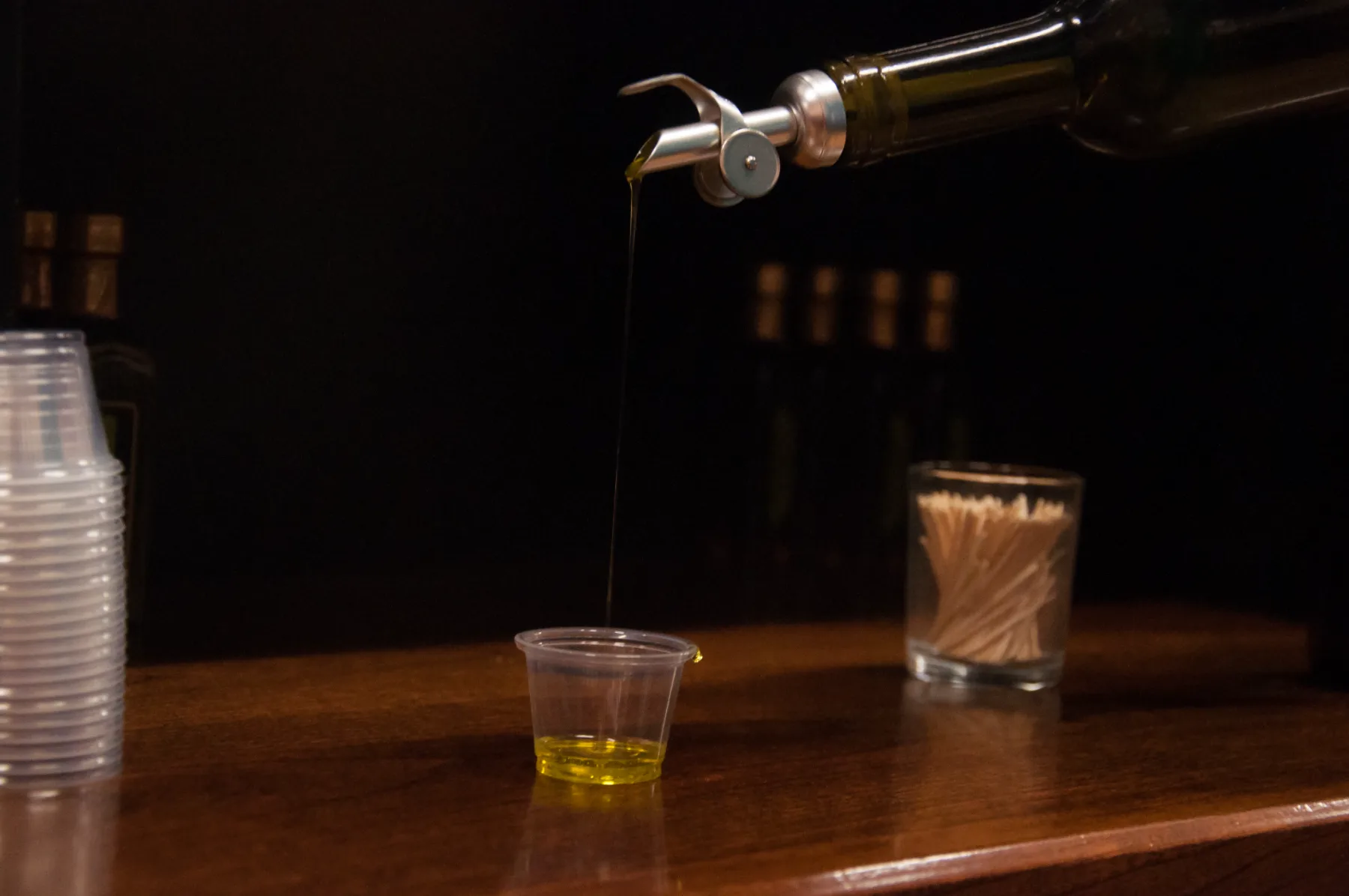 Olive oil pour at the tasting bar