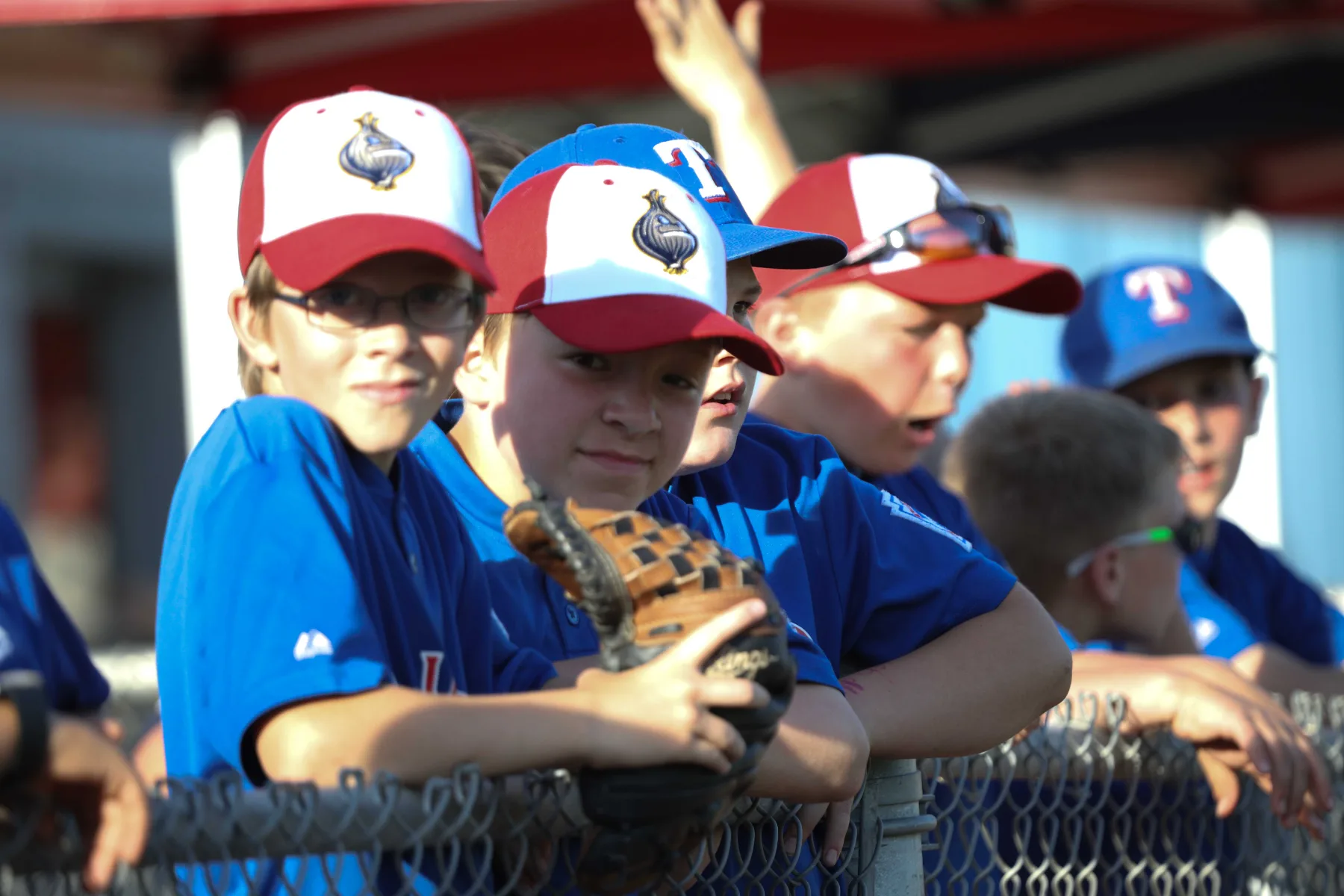 Young fans in Sweets caps at the dugout rail